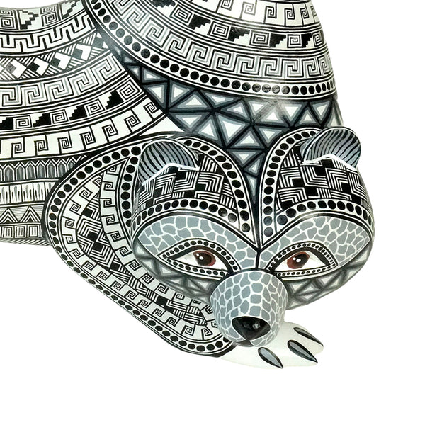 Close-up of the bear wood sculpture, handmade in Mexico.