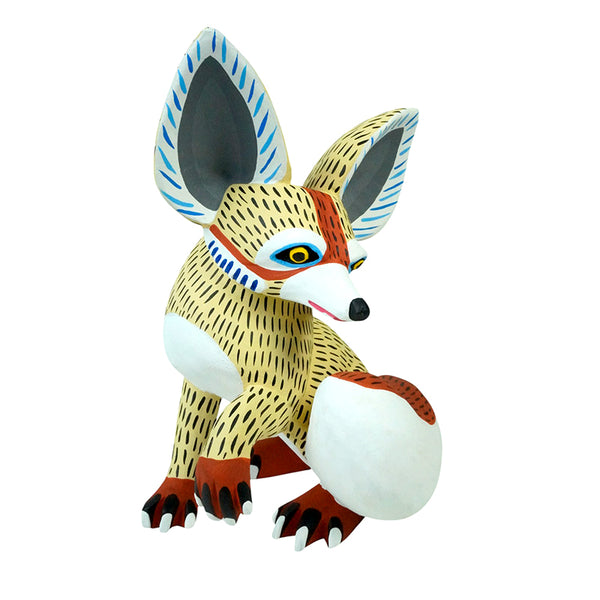 Mexican fox figure handmade in Oaxaca. It is painted in beautiful authentic Alebrije style in cream, terracotta and grays.