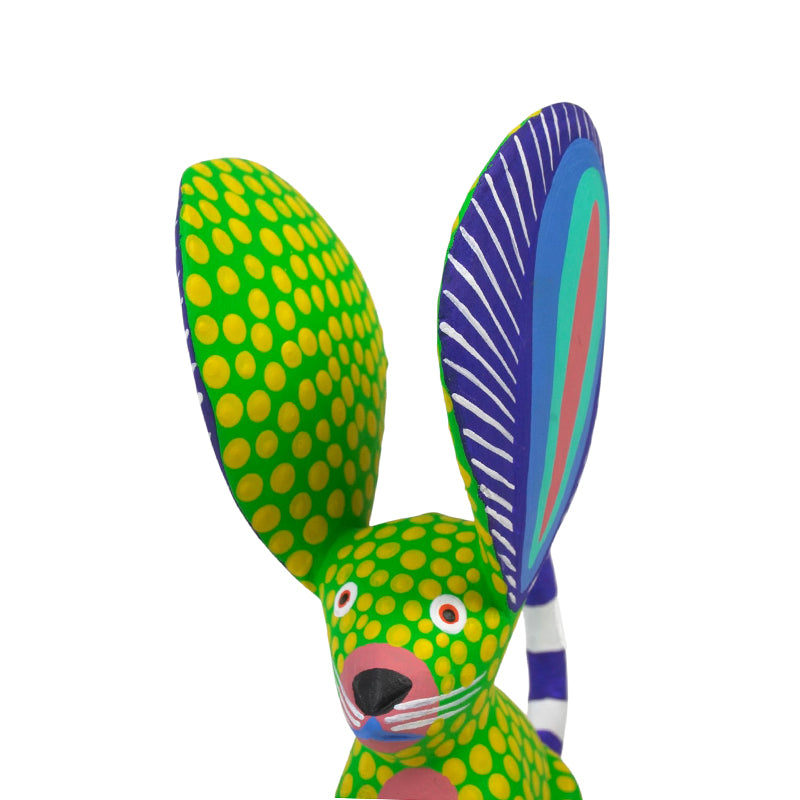 Close-up of the mouse's pink muzzle, painted whiskers and colorful inner ears
