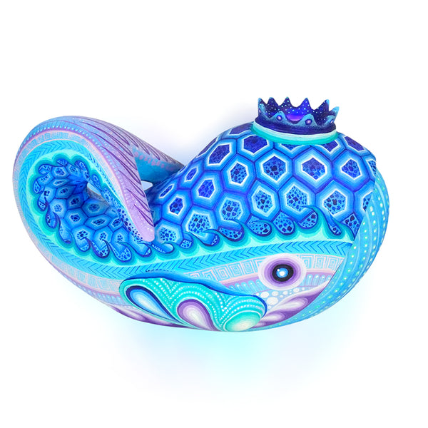 Wood whale sculpture authentic Mexican Folk Art. Intricate hand painted blue patterns on a white background