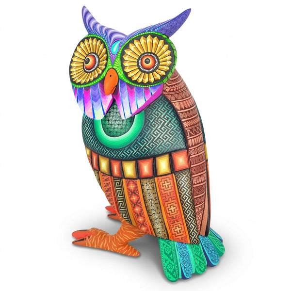 Colorful alebrije owl figurine with intricate patterns on a white background