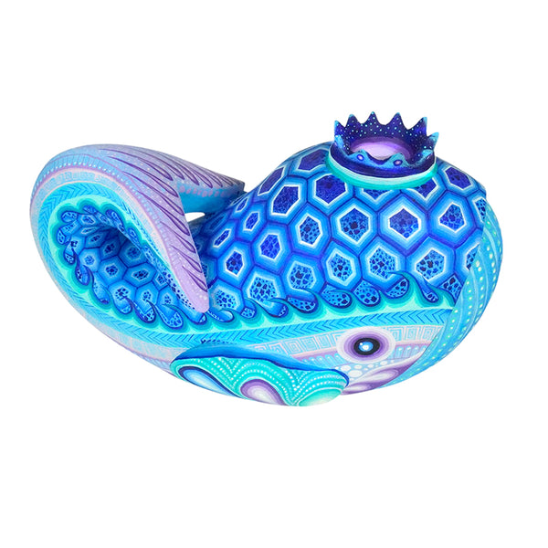 Handcarved whale figurine from Oaxaca Mexico. Painted in hues of blue and lavender