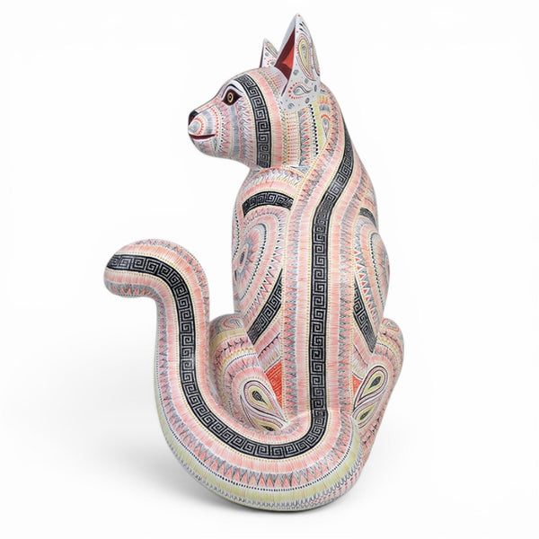 Decorative cat figurine Alebrije handmade with intricate patterns on a white background