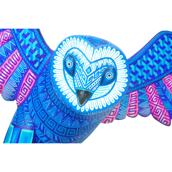 Owl face of a wood figurine made in Oaxaca