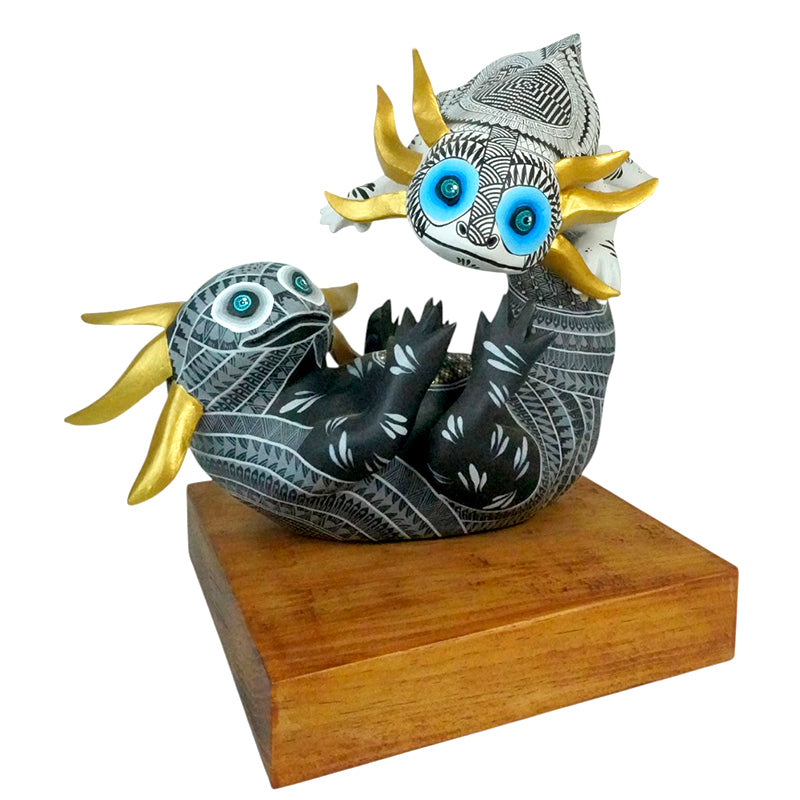 Oaxacan wood carving of two Axolotes