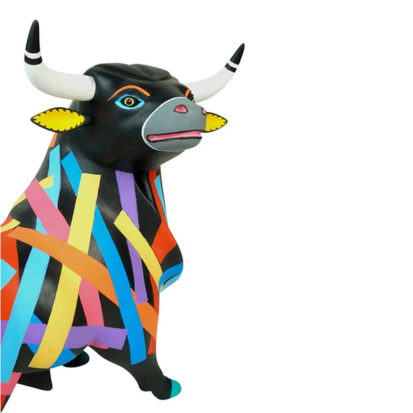 Mexican woodcarving of a colorful bull.