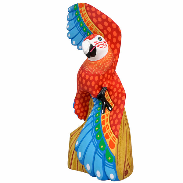Alebrije parrot figurine with a white background. Handmade in Oaxaca