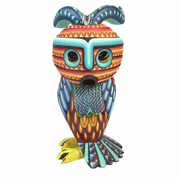 Colorful owl Alebrije figurine with decorative patterns on a white background