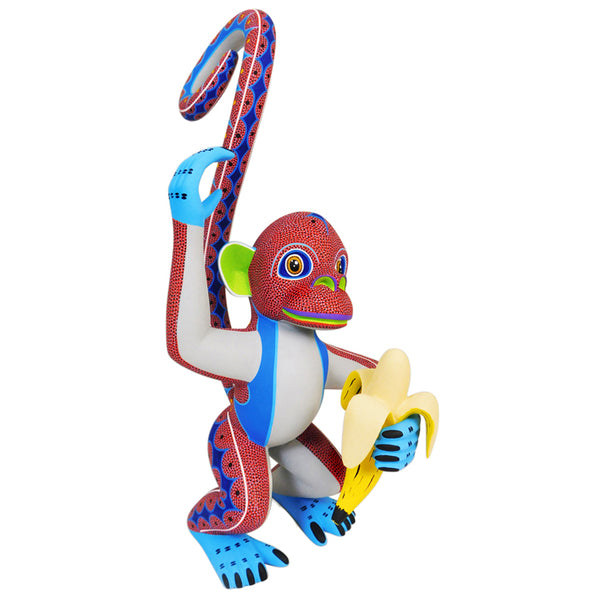 Monkey with a banana figurine hand-carved in Mexico
