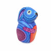 Wood Alebrije bunny hand painted in bright blues, lavender and orange colors