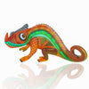 A colorful decorative chameleon figurine with intricate geometric patterns in orange, green, yellow, and red, displayed on a reflective white surface.