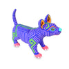 Colorful dog wood figurine handcarved in Oaxaca with geometric patterns on a white background