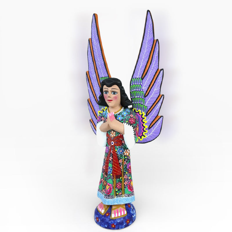 Handmade wood guardian angel figurine made in Mexico. 