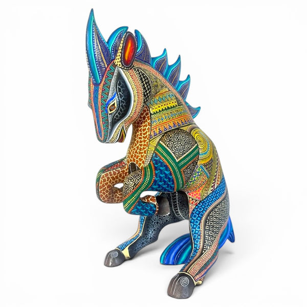 Colorful horse Alebrije figurine with intricate patterns on a white background