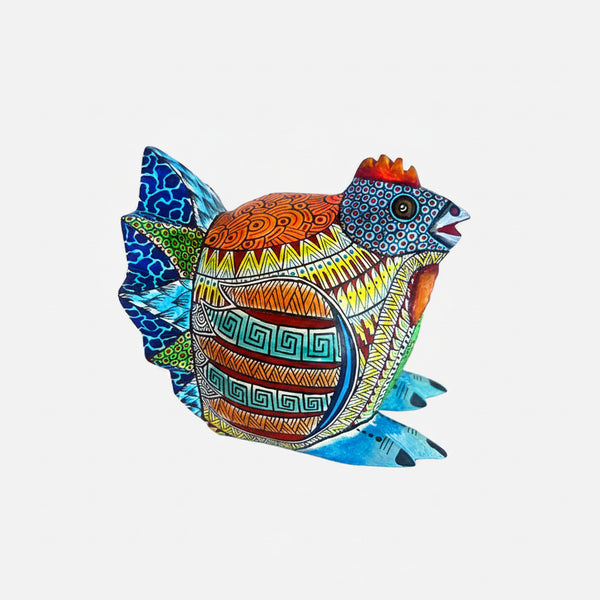 Colorful decorative hen Alebrije  with intricate patterns on a white background