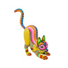 Colorful Oaxacan alebrije cat stretching, hand-carved and painted.