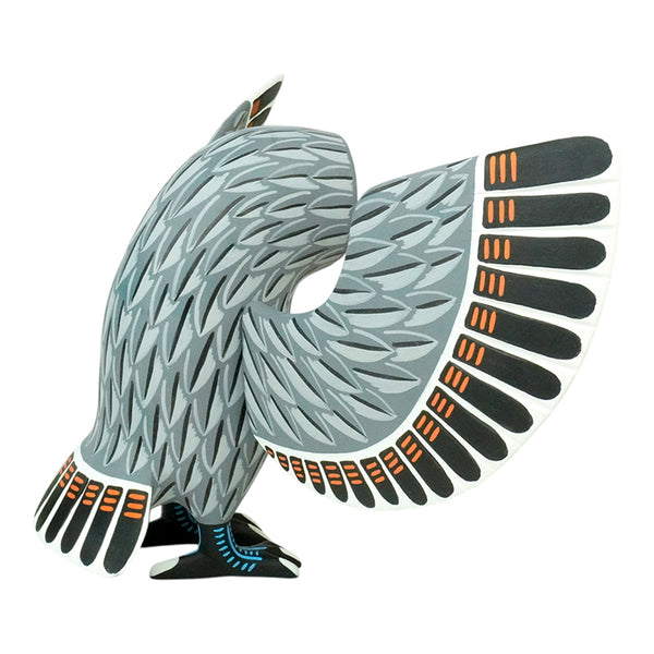 Oaxacan woodcarving of an owl in grays