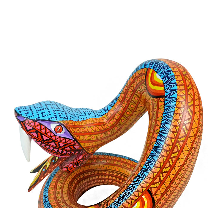 Close up of a rattlesnake wood sculpture 