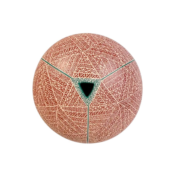 Top view of Mata Ortiz pottery seed pot showing intricate sgraffito triangle and diamond patterns radiating from a teal-rimmed opening