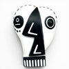 Abstract Picasso-inspired wood black and white face on a white background