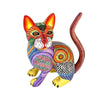 Colorful cat wood Alebrije figurine with intricate patterns on a white background