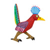 Authentic wood carving  figurine with a vibrant pattern on a white background