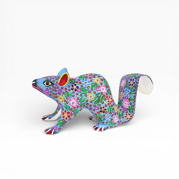 Copal wood  squirrel  figurine with floral patterns on a white background