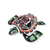 Decorative turtle Alebrije figurine with tribal patterns on a white background