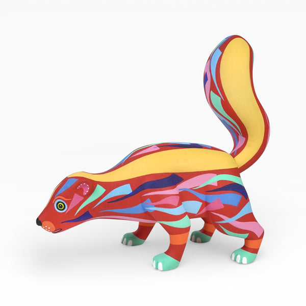 Copal wood skunk alebrije  figurine with a long tail on a white background