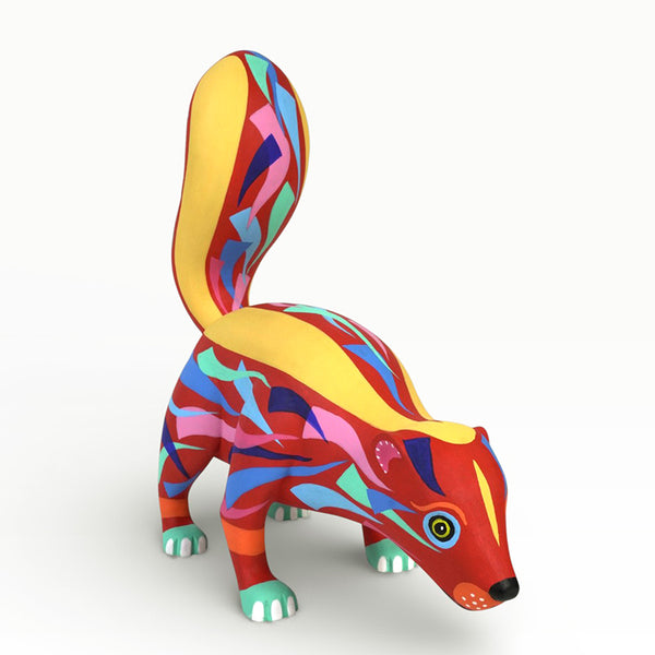 Colorful handcrafted skunk figurine on a white background
