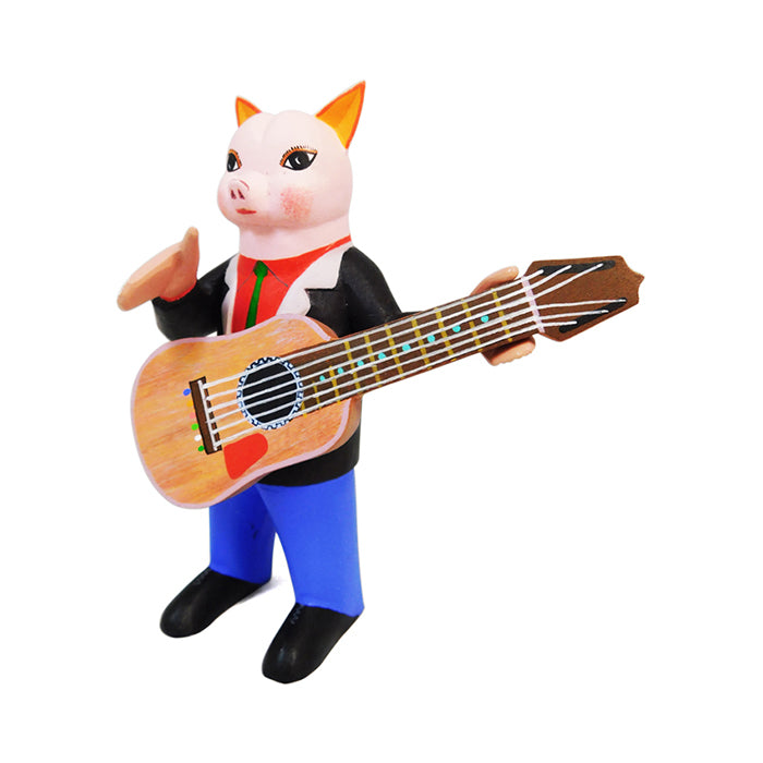 Avelino Perez: Guitarist Pig  Woodcarving
